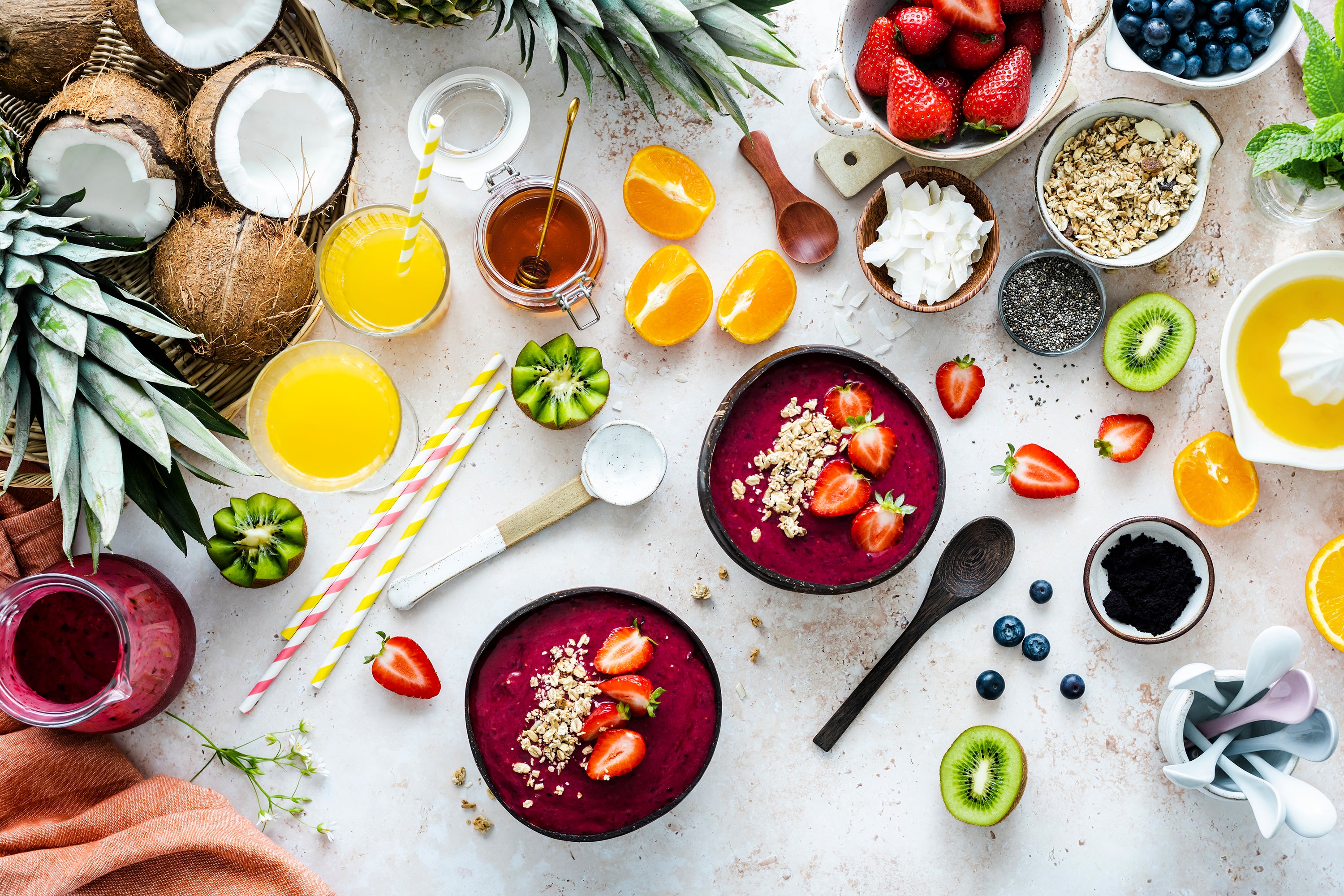 preparing-acai-bowl-flat-lay-style-with-tropical-fruits-grains-2.jpg